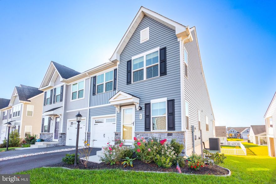 SELLER IS MOTIVATED - In the desirable Arcadia Springs North community! This stunning end-unit townhouse, built in 2022, offers modern living at its finest, featuring main-level living, a walkout basement, and a big sky view from the back deck! The open floor plan is perfect for entertaining guests during the holidays or for those seeking convenience without stairs in their daily routine. This home is equipped with a top-of-the-line Culligan water softener filtration system, complete with a transferable warranty, and an updated HVAC system maintained by B&B Heating. The TrueGreen-maintained lawn and landscaping, with annual aerations, ensures the exterior is as well-cared for as the interior. The walkout basement provides additional versatile space, with plumbing roughed in for a potential fourth bathroom, offering even more opportunities for finished living space. An added storm door on the front also  provides enhanced security and protection against the elements. With contemporary finishes and these valuable upgrades, this property is a must-see for anyone seeking comfort and convenience in Martinsburg!