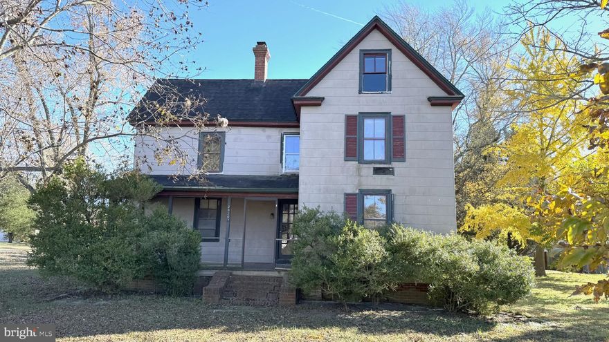 This large four four bedroom, 2 and a half bath home needs someone with a vision to bring it back to its former glory. On the first floor is a bedroom, full bath with laundry and a half bath. There is a family room with lots of natural light and a huge kitchen. A half bath is tucked under the staircase. Upstairs are three more bedrooms and a full bath. The home has a walk up, floored attic and a partial basement. The oil furnace no longer works. This home sits on a lovely lot with mature pecan trees, a ginko tree, fruit tree and grape arbor. Being sold AS IS.