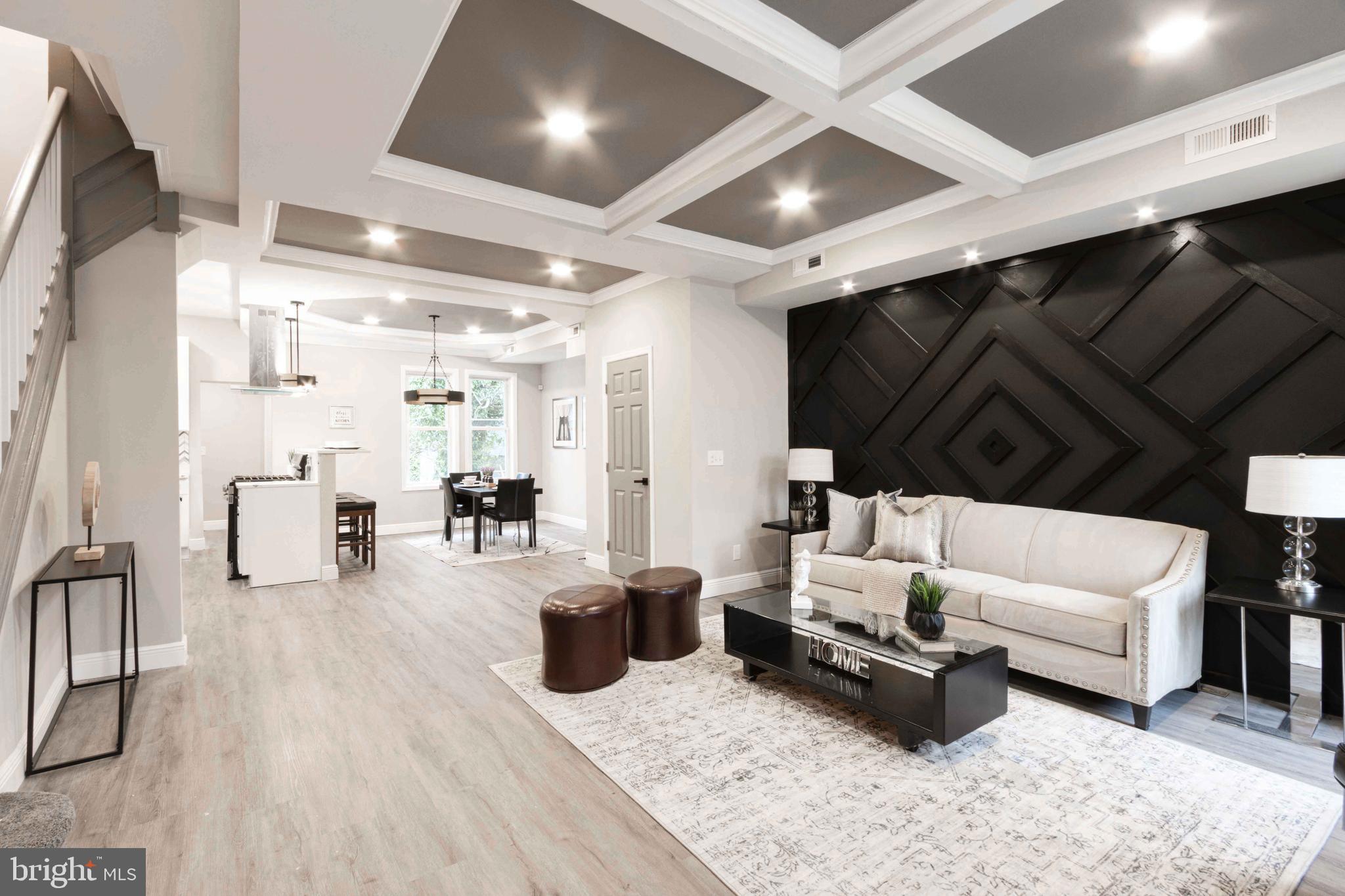 Spring is upon us... and so is this gorgeous home! Discover this stunning 4 bedroom, 3.5 bathroom end-unit brick townhome gem nestled in the heart of the city. This open floor plan designed for effortless entertaining, boasts sleek quartz countertops, stainless steel appliances, 42-inch kitchen cabinetry, a waterfall quartz island with ultramodern pendant and chandelier lighting. The custom feature walls on the main level and inside of the upper level primary bedroom, adds a stylish focal point where urban elegance meets modern comfort. This home offers the perfect blend of comfort, style, and city convenience. This house is waiting to welcome you home. Reach out to schedule your private tour today!