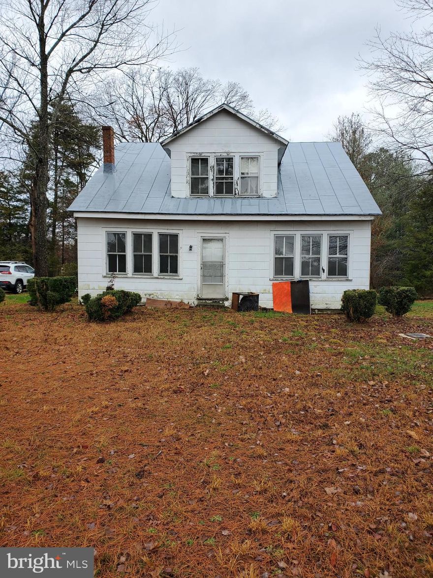 Charming home located on over 16 acres with a water on the back on the property.   Home features 2,016 square foot house  with 4 bedrooms and 2 bathroom, hardwood floors. Looking for the charm of farm home that is waiting for some TLC and lots of privacy, then look no farther.  Envision this home the way you want it, go see it today and begin your new adventure.