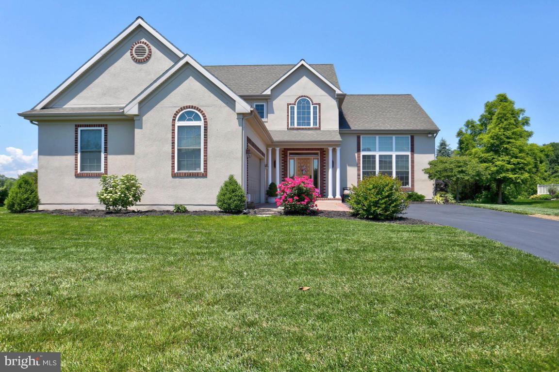 Beautifully maintained 2 story home that includes a 2 1/2 oversized attached car garage with apoxy flooring. An open floor plan with a LR/DR/FR combo that includes a large gas FP, Australian Cypress Hardwood Floors throughout most of the home, elegant kitchen, Master BR & BA on the 1st fl., 1st fl. laundry room/office, nice sized partially finished basement with tons of storage, gas heat, central A/C, 3 zoned high efficiency Carrier Infinity Heating System, circulator pump on the water tank and a large relaxing outdoor screened porch and deck that faces serene Manor Twp. grounds & walking trail.  Lots of upgrades inside and out!  This home is move-in ready.