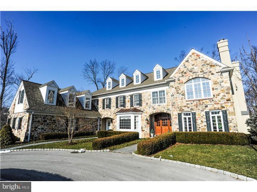 Grace, elegance and beauty describe this estate home nestled on a 4.84 acre partially wooded lot which abuts a 50 acre conservancy.  Upon arriving on the circular drive, you are drawn into a Grand Reception hall which shows off the formal Dining Room and formal Living Room.  The Living Room features a gas fireplace and leads to the cherry Library from elegant French doors.  An enormous great room boats coffered ceiling and beautiful fireplace.  Entertaining is a pleasure with this European inspired custom kitchen with stunning, over-sized granite Island, complete with sink, a Wolf 6 burner range, a Wolf electric oven and warmer tray, two dishwashers plus a sub-zero refrigerator are waiting for large parties or quiet dinners.  Enjoy the sun-filled Morning Room which features a large Bay window and lovely custom built-ins offering tons of storage and the entrance to the RR Bluestone patio.  A well appointed Butler pantry with sink and 2 powder rooms plus multi-use Mud room complete the first floor.  The Upper level of this fine home boasts a large Master Bedroom with lovely Sitting Room and lavish Master Bath.  The Jack and Jill bath is convenient to two of the nice sized bedrooms, while the fourth and fifth bedrooms have their own bath.  The second floor is completed by the office/computer room, a laundry room and stairs to yet another level!  The third floor is not finished yet, but oh the possibilities.  The Lower Level is finished into a dream get away with its Mahogany Bar, refrigerator, sink, dishwasher, ice maker, full bath and tons of storage.  This home flaunts extensive Brazilian Cherry hardwood floors, magnificent Millwork and custom built-ins throughout, 3 fireplaces, 4 car garage and front & back stairs. Spring Meadow Farm offers a quiet setting yet easy access to the new PA slip ramp, shopping districts & restaurants, schools, corporate office parks & Valley Forge National Park.