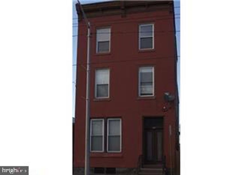 2 unit brick building with private parking. Very spacious rooms. This is a must see! Call for your private showing today!
