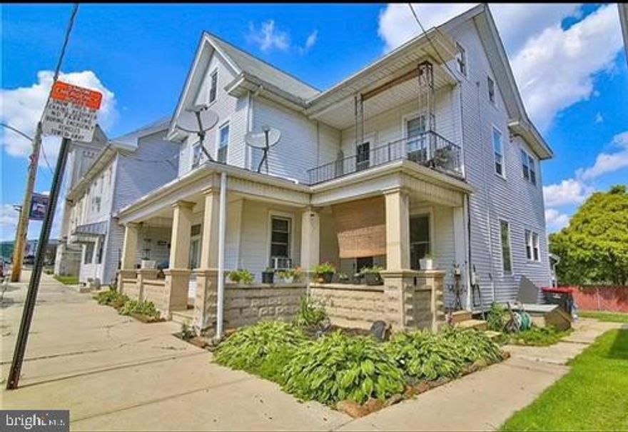 The stateliness of this home gives the feel of a single, but behind that covered porch and landscaped curb appeal sit two apartments for you to make some moneee - over 8% cap rate. This beautifully maintained home is perfect for investors or those looking to live in one unit while renting the other. Each two bedroom unit has recently been painted, an updated kitchen, upgraded heating/cooling and in-unit laundry. It is centrally located with shopping, schools, and hospitals close by.