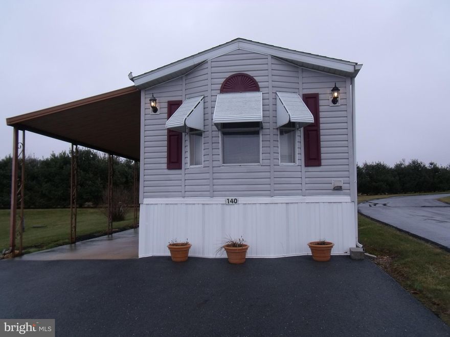 Great home on corner lot. 2 BR 1.5 BA. Large open kitchen, living room & sitting area. Covered patio/deck/car-port area & shed.