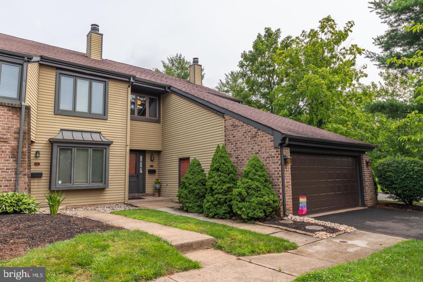 A rare oppurtunity to own an end unit with 2 car garage and driveway in the sought after Headley Trace neighborhood just steps outside of Newtown Borough. Walk through the front door into the tiled foyer leading either up the curved staircase or down into the sunken family room. The family room is spacious with an abundance of light from the large side windows with beautiful hardwood flooring and a wood burning fireplace. Open to the family room is a large dining room currently being used as a sitting room/playroom. On the back of the house is the kitchen area with large eat-in kitchen and sitting area. Plenty of cabinet and counter space with a breakfast bar for stool seating. Sliders open to the back patio and fenced in backyard. This end unit features extra space on the side yard.  Completing the first floor is a large kitchen pantry and updated powder room.  Upstairs you will find 3 nice sized bedrooms and 2 full bathrooms. The main bedroom has plenty of light and ample closet space with a tastefully updated  3 piece en suite. A large hall bath and laundry room complete the second floor. This home has a newer HV/AC system (2018),  plenty of storage space in a pull down attic,  community pool, basketball and tennis courts,  is located just outside Newtown Boro, easy access to 95 for commuting to Phila/NJ/NY. Award winning Council Rock School District. Don't miss this one!