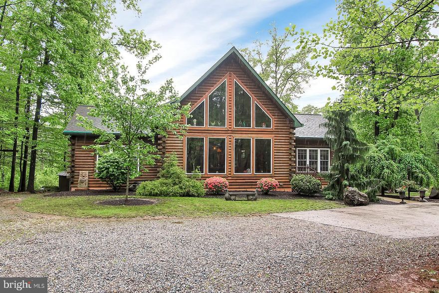 This Gentleman's farm is sure to impress! The living room is bathed in light from the grand windows and features a stone FP.  The open floor plan is perfect for entertaining   The 1st floor master bedroom suite is spacious with a walk in closet, and a full bath. Additional 1st floor bedroom or office showcases beamed ceilings and a bath. 2nd floor master suite has a bath and stone FP.  The basement has ample storage and is partially finished with door to the patio.  The barn features 6 stalls, an office, a hay loft and electronic stairs. The possibilities are endless-this property would make a great bed and breakfast, doggie daycare, alpaca farm, raise small livestock, horses, whatever you can dream up-just don't forget to check with the township to make sure it's allowed.   This beautiful  property has too many features to mention here but a list is in associated docs.