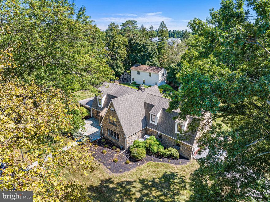 Elevate your lifestyle in this extraordinary stone colonial that includes a separate 2 story 1.280 sqft building that could be utilized as a luxury office, In-laws / au pair quarters, game room and or work shop. Located in the sought-after Lapidea Hills, just a heartbeat away from the prestigious Strath Haven Schools and a pitching wedge from The Springhaven Country Club. Imagine pulling into your tree-lined, corner lot with impeccable curb appeal, where mature landscaping beckons, and a fully fenced yard promises endless outdoor joy. Here, three flagstone/slate patios offer alfresco delights—one boasting a mesmerizing outdoor fireplace, setting the stage for unforgettable evenings under the stars.
Step inside to an expansive foyer where a beautiful oak stairway heralds the elegance of the home. Your expansive living room, large enough for a baby grand piano AND your furniture, is a sanctuary featuring a cozy stone fireplace, with custom barn door perfect for warming hearts and toes.
Magical holidays and family gatherings await in a formal dining room that radiates hospitality and charm.
Experience year-round splendor in the 4-seasons room, awash in natural light, and seamlessly connected to the kitchen. First-floor living is rounded out with a convenient and oversized laundry room/mudroom, pantry, and an elegant powder room.
Upstairs, your Primary Suite is a true haven, offering dual walk-in closets and a lavish bath with a spacious walk-in shower, dual vanities, and heated floors—a daily spa experience! Accompanied by three additional ample bedrooms and a large hall bath featuring another double bowl vanity. A walk-in cedar closet accommodates clothes for all seasons. The upstairs is a retreat for everyone in the family.
The large, finished basement is the cherry on top! Treat yourself to wellness in a brand-new 6-person sauna and brand-new full bath. Secure valuables in a walk-in climate controlled vault and enjoy the convenience of a separate utility room and direct access to an oversized garage.  
Don't miss this rare opportunity to secure your dream home in a location that epitomizes both luxury and convenience. Welcome home!