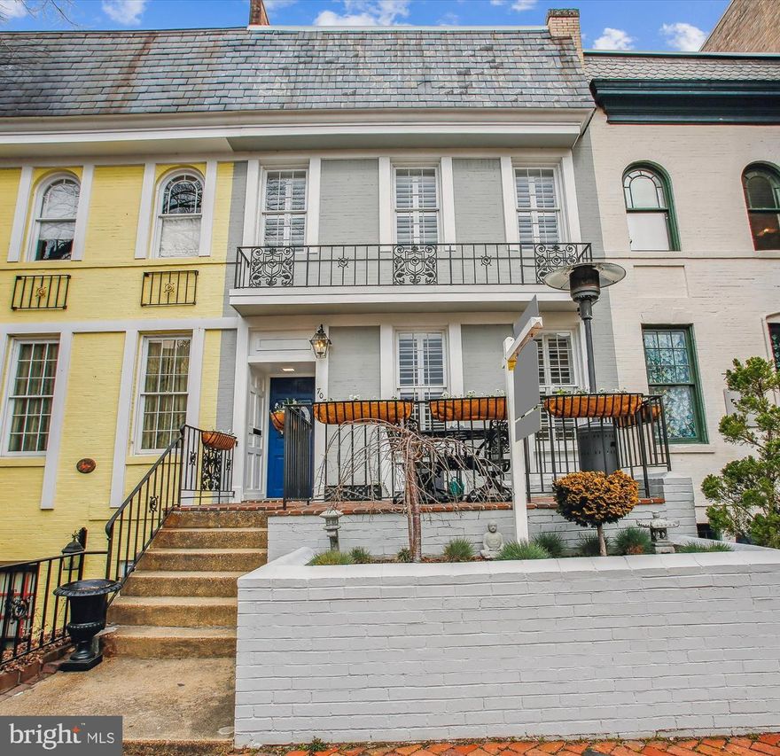 Experience the epitome of turnkey living in this breathtaking Old Town rowhome, boasting a unique opportunity for eligible buyers: an assumable VA loan at an enticing 3% interest rate. From the moment you approach the home, you're welcomed by a charming elevated patio and a raised flower bed, setting the stage for what is within.

As you step inside, the home opens up to a bright and spacious floor plan, renovated in 2020 to merge modern comforts with timeless elegance. The interior is adorned with hardwood floors, soaring ceilings (over 9ft), crown molding, and custom real-wood plantation shutters, complemented by a distinctive custom, vintage-brick exposed wall that adds character and warmth to the space.

The front of the home is thoughtfully designed with a living room, dining area, and a convenient half bath, leading to a centrally located kitchen. This culinary space is a chef's dream, featuring a center island, an abundance of counter space, and extensive cabinetry. Adjacent to the kitchen, the family room provides a cozy retreat with direct access to the deck and the convenience of TWO off-street parking spaces in the rear. This open main level is perfect for family time and social gatherings!

Ascend to the upper level to discover the primary bedroom suite, complete with an en-suite bathroom and a spacious walk-in closet. Two additional bedrooms share a Jack-and-Jill bathroom, with the added luxury of laundry facilities on the same level.

The basement offers versatility with a fourth bedroom, a third full bathroom, and a large recreation room currently serving as a gym and media space. Additional washer/dryer hookups in the basement and direct exterior access provide potential for an au pair or in-law suite. Recent upgrades include a new roof and gutters in 2023, a new HVAC system in 2022, and storm windows with UV coating on the rear of the house. A new beverage fridge in the kitchen adds a final touch of convenience to this immaculate home.

This residence is not just a house, but a home ready for new memories, further enhanced by the rare benefit of an assumable VA loan at 3% interest, offering significant savings for eligible buyers. Don't miss this unparalleled opportunity—contact the agent today for more details and to make this dream home your reality.