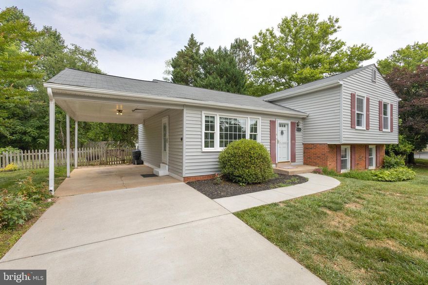 Georgeous and Updated Split Level on private cul de sac in sought after neighborhood of Lake Braddock! Dazzling New Kitchen boasts an immense island with a breakfast bar for visitors to sit and sip while you prepare meals. Sparkling pendants highlight the gorgeous quartz counters. New Whirlpool refrigerator/freezer with double french doors, top & bottom/side by side openings. Whirlpool gas stove and built-in microwave. New Whirlpool dishwasher. New sink, faucet, soap dispenser & disposer. New luxury vinyl plank flooring adds beauty and ease of maintenance. Overhead light discs installed to brighten your nights. Natural light pours through the huge windows in the main level living and dining spaces. New patio door leads to a large deck to extend your living space to the great outdoors. Imagine comfy weatherproof lounge chairs for relaxing or hosting holiday barbecues. The level, cleared backyard is private and perfect for kicking a ball around or playing fetch. Freshly painted throughout, and a new thermostat was added. New lights/fan installed in upstairs bedrooms. Primary BA has a new toilet, vanity/sink/faucets and accessories. New Carpets in Bedrooms! The new flooring continues downstairs in the cozy den with a fireplace, a completely remodeled full BA, and an office/craft room/guest room. A huge utility room offers storage and a new hot water heater, washer and new dryer. Most split level models stop here, but open the door to get a surprise - a huge sub-basement also with new flooring! Add a home theater for a media/game room, acoustic tiles, speakers & mirrors for a music/dance/exercise room, or expand your home-based business in a quiet place where you can focus and spread out. Located in a highly requested school district, rich with community amenities - a 22 acre lake with trails, playground and a boat ramp, two pools, a clubhouse and tennis/pickleball courts. Plentiful grocery stores and dining options nearby, plus Walmart/Target/Kohls. Close to VRE, Rte. 495 and a direct bus to the Pentagon. This is a MUST SEE property!