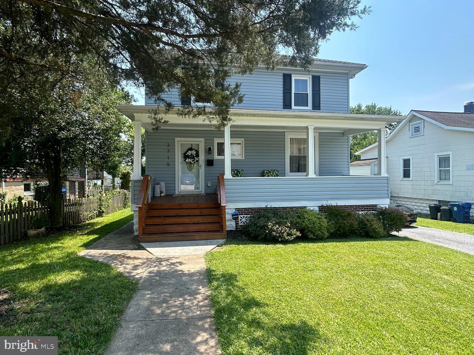City living brimming with charm and character! This beautifully updated and tastefully preserved home perfectly marries timeless appeal with modern touches, making it one you’ll be proud to call your own. The grand front porch invites you into a spacious and open interior, where traditional design meets contemporary comfort. Enjoy expansive living and dining areas with crown, chair, and picture moldings, gleaming hardwood floors, and large windows that fill the home with natural light. The main level boasts a stylish kitchen with shaker cabinets, granite counters, and stainless steel appliances, along with a convenient laundry center, powder room, and a rear covered porch that opens to a sprawling backyard — ideal for gatherings and relaxation. Upstairs, you’ll find three generously sized bedrooms and two full baths, including a primary suite with a private bath, double closets, and access to a serene balcony retreat. The lower level offers a finished full bath and versatile space that can serve as a workshop, fitness area, office, playroom, or storage. Outside, a partially fenced yard, concrete patio, and ample space for gardening and entertaining complete this inviting urban oasis. Includes a dedicated EV charging station, equipped with a built-in charger for added convenience — perfect for electric vehicle owners.