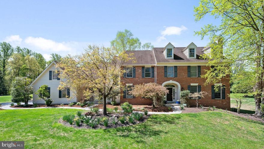 Welcome to 2 Saw Grass Lane in bucolic Malvern in the popular Whitehorse community in Great Valley School District. This beautiful home features 4 bedrooms, 3.5 bathrooms, a finished lower level with a built-in bar, gym, and wine cellar situated on a premium 2.4 acre flat lot.  A paver walkway leads to the welcoming front entrance, where refinished hardwood floors seamlessly flow throughout the first floor. To the right is the formal Living Room featuring crown molding and cozy gas fireplace. Glass French doors lead into the adjacent private Office with built-in cherry cabinetry and a triple window to take in the serene view. To the left of the spacious foyer is the formal dining room adorned with classic crown molding and wainscoting. The eat-in Kitchen, equipped with white cabinets, a GE Café range, Bosch dishwasher, and GE Profile double ovens, is a culinary delight. Adjacent to the kitchen, the Family Room, warmed by a gas fireplace and huge windows provides the perfect setting for relaxation. The second level offers four generously-sized bedrooms and two full bathrooms. The primary suite is a haven of luxury, with a sitting room, two walk-in closets, bedroom with tray ceiling, and an en-suite bathroom featuring a Jacuzzi tub, 2 vanities, and stall shower. There are 3 additional nice-sized bedrooms (with laundry chutes!)  that share a hall bathroom with a double vanity and a tub/shower combo and convenient back stairs to the kitchen. The finished lower level is an entertainer's dream, boasting a second kitchen/built-in bar with full size refrigerator, warming drawer, dishwasher, & wine fridge, gym, living room, full bathroom with steam shower, and a 1350-bottle temperature-controlled wine cellar and laundry room. The outdoor space is equally impressive, with a HUGE, flat yard, mature plantings and a new blue stone patio, ideal for alfresco dining. This home features a whole house generator for your peace of mind and built-in speakers in the living room, family room, kitchen, primary suite and outside on the patio. This beautiful home is just minutes to Route 29 with access to the PA Turnpike & Route 202 with ample shopping and  Wegman’s. A few miles away is Malvern Borough with it's myriad of local shops & restaurants. If you need public transportation with access to Philadelphia or New York City, both the Malvern & Paoli train stations are a short drive away. This gracious home offers space for intimate family moments yet space  for extensive, luxurious social events.