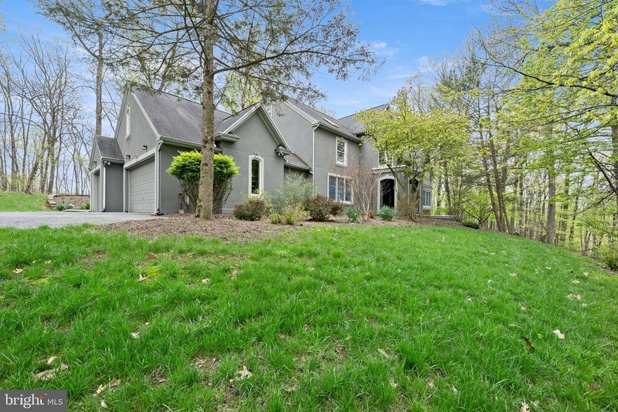 Welcome to 6688 Haasadahl, a private luxury retreat set on over 5.5 wooded acres with breathtaking views overlooking the Lehigh Valley. Designed for both elegant entertaining and comfortable everyday living, this Parkland SD home features a sprawling floor plan, expansive windows that frame the natural landscape, and a stunning double-sided fireplace that anchors the main living spaces. The primary suite provides a spa-like escape, featuring a soaking tub beneath a skylight and window that fills the space with natural light and peaceful woodland views. The finished walk-out basement adds incredible flexibility for a media room, gym, recreation space, or guest retreat with direct access to the serene wooded setting. Custom finishes and thoughtful architectural details elevate the home throughout, while the location offers convenient proximity to major commuter routes, Fortune 500 employers, and premier healthcare networks including Lehigh Valley Health Network and St. Luke's University Health Network. A rare opportunity to own acreage, privacy, and luxury living — all in one remarkable Lehigh Valley address