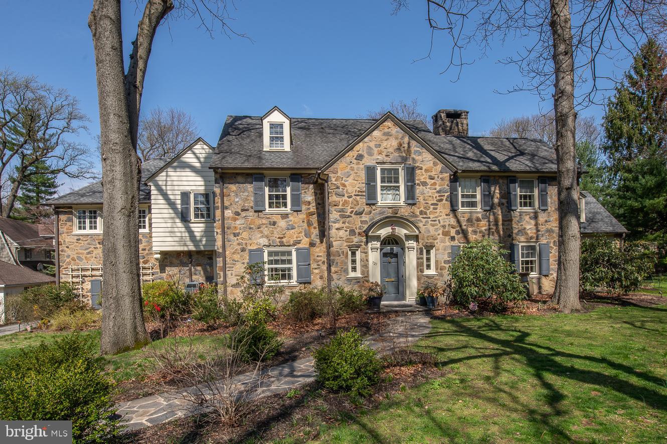 At the end of a cul-de-sac in the desirable Merion Station neighborhood sits a lovely stone Center Hall Colonial. Follow the newer flagstone path to the elegant front door. Upon entering the grand entry with a beautifully curved staircase and 9 ft ceilings, you'll find formal dining to the left and a grand living room with a wood-burning fireplace to the right. Through the living room are French doors to the covered porch. Butler's pantry with Soapstone counter, copper sink, Ann Sacks backsplash, and V-Line beverage fridge. Another exit to the flagstone patio, great for entertaining. Amazing cooks kitchen addition by Architect Abby Schwartz has every high-end appliance you could think of, not limited to built-in Miele coffee maker, Miele convection/micro oven, Wolf range, Gaggenau steamer with water filler spigot, Dacor warming draw, Julien stainless sink, Bluestar refrigerator, Bosch dishwasher, and two Fisher Paykel dishwasher drawers. Accenting the kitchen are the Portobello cabinets, a large center island with hidden utility drawers, banquet seating, and a dry stack stone gas fireplace. The ceiling in the kitchen is vaulted with shiplap and extra second-story windows allowing light to flood into the space. Another set of doors with hidden screens exits to the flagstone patio dining area. Family room off kitchen leads to double size mudroom and garage entrance. Custom Waterworks powder room. Back stairs are very conveniently located off Mudroom area. Sun drenched office with newer windows and built-ins. The whole home has beautifully finished hardwood floors. Owners suite with crown moldings, walk-in closet, Juliet Balcony, and bath featuring Kohler whirlpool tub, shower, and built-in make-up station. Fabulous laundry room with sink, built-in cabinets, and ironing board hidden inside drawer. Bedroom 2 has wood floors. Bedroom 3 has wall-to-wall Ralph Lauren carpeting. Bedroom 4 opens to the hallway powder room. 3rd floor has 2 more bedrooms, and 2 full baths, one with stall shower and 1 with a clawfoot tub. Hidden 3rd floor playroom. Basement has a laminated tile floor with playroom, gym (equipment except Peleton staying), and half bath. Room with an extra refrigerator (staying), and wine storage closet.