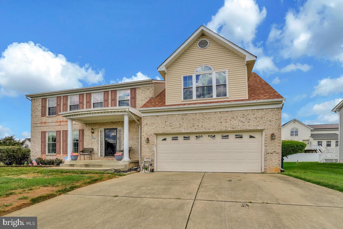 Beautiful brick-front Colonial with 2-car garage is ready to welcome its next owner. Lovingly maintained by the original owners, this home offers a wonderful opportunity to create lasting memories. The main level features a bright living room, formal dining room, spacious kitchen, and a cozy family room with fireplace. Step through the sliding glass doors to enjoy outdoor living and entertaining on the expansive deck with screened gazebo and paver patio. Upstairs, you’ll find four bedrooms, including a generous primary suite with vaulted ceilings. The finished lower level adds even more living space with a recreation room and a third full bathroom. This home shows beautifully and is being offered as-is. Quick closing and occupancy are available for those ready to make it their own.