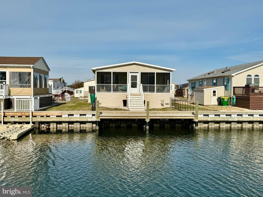 Welcome to 26221 Cove Dr a three year young Waterfront home with gorgeous water views.  This tranquil canal front home was built recently in 2022 and is located just minutes to the Rehoboth Bay!  This lovingly maintained young home offers the peace of mind knowing that all your systems are just a few years old, so you can enjoy your tranquil waterview stress free. The moment you step into the home you will be greeted with warm luxury vinyl plank flooring that stretches throughout the modern open floor plan from the entryway into the living room, kitchen, and dining area.  The home features a spacious kitchen with plenty of cabinet space, modern recessed lighting, stainless steel appliances and a large island perfect for entertaining your family and friends.  Past the living room is a tranquil screen porch overlooking the canal, a perfect space to relax after a long day at work or to entertain your family and friends.  The Owners suite is spacious with a walk-in closet and a modern ensuite bathroom with updated cabinetry, updated modern fixtures and updated modern lighting. Down the hall are two spacious guest bedrooms and an updated modern guest bathroom with stainless fixtures. The home is located in the sought after community of Mariners Cove with fabulous amenities like Club house, Community Pool, Fitness Center, Picnic Area, and Marina. The community is located in Long Neck in Millsboro and just a minutes to your favorite local restaurants, and shopping, and a short drive to the Rehoboth Beach and Boardwalk.