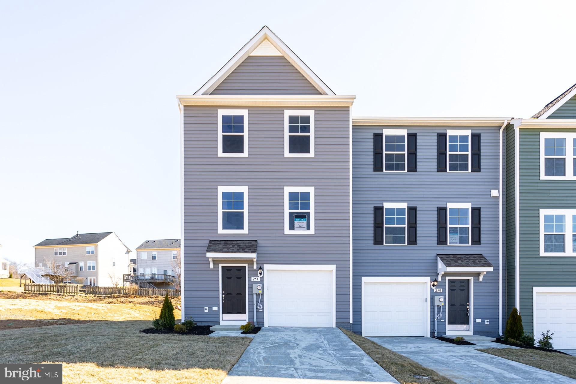 ***OFFERING UP TO 10K TOWARD CLOSING COSTS WITH USE OF PREFERRED LENDER AND TITLE***
Welcome to the beautiful community of Archer's Rock! Brand New 3 bedroom/2.5 bath townhome with a walkout unfinished basement (Total of 2100 sq ft with future finished basement). Features an open 1st floor plan with a sunroom (our largest extension), an 8 ft island, upgraded mission style grey kitchen cabinets with pearl jasmine quartz countertops, stainless steel appliances, kitchen backsplash, pendant lighting and much more. Popular luxury vinyl plank adorns the entire 1st floor. Owner's bedroom features a walk in closet and deluxe owners bath and tile surround. Separate walk in shower and deep soaking tub. Minimum outdoor upkeep with lawn care included as well as trash pick up in the HOA fee. Minutes from I81 but nestled in a quiet country setting!! Location is great for VA and MD commuters. Just a short drive to Winchester, Va and Hagerstown, Md. Archer's Rock is in it is final opportunities. Inquire about additional incentives available. This popular Martinsburg community is located in a peaceful, rural area at the heart of Berkeley County. All of the most popular regional destinations are accessible within minutes, including the downtown scene, shopping malls and the Amtrak Station. If you’re ready to move to Archer's Rock as soon as possible, these homes are your best bet! Please call today for an appointment or for more information. Inquire about the additional closing cost incentives available.