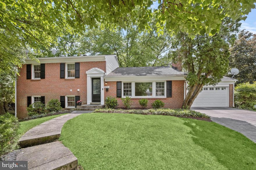 This spacious split level home, on a large corner lot, was expanded by the current owners to have a big Kitchen, including an Island, ample cabinetry and a Breakfast nook.  And, unlike most splits, it has a main level Powder room.  AND they added a Two-car Garage just off the kitchen!<br/><br/> Upstairs there are three Bedrooms and two Baths, both of which have been partially updated. Down a few stairs from the main level is the expanded Family room - nearly doubled in size! - with lots of windows (Andersen replacement!) for great light and French doors to the backyard.  This level also has the 4th Bedroom, a full Bath, a small Office and the Laundry room. There is another level down where you find a large Recreation room and the Utility room.<br/><br/> The neighborhood of Woodburn is a close-in community that is convenient for commuting into downtown DC or to nearby northern Virginia. A short drive gets you into thriving downtown Bethesda or Friendship Heights and the Capital Crescent Trail is only about a mile away. When the redevelopment of Westbard Square is complete, this home will benefit from having easy access to the trendy new shops and restaurants that are planned there. Check out the public schools that serve this house and you will realize what a terrific value is offered here!