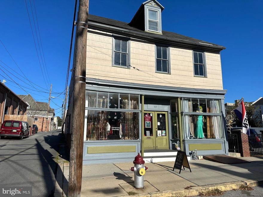 Welcome to 17 S Third St. Columbia PA. This building is located next to the  historic Columbia Market House.  The front store has approximately 1225 sq.ft and the warehouse in the back approximately 1550 sq.ft per the county records. The storefront is leased at $1100 per month  The warehouse space is currently vacant and it was previously leased at $1,000 per month.  Warehouse space (25' x 62') is available for lease. The residential apartment is located on the 2nd and 3rd floor of this building and offers a LR, Kitchen, 3 bedrooms and 2 full bathrooms. Separate gas heat, electric water heaters and electric meters for the store front and the apartment. Rent for the apartment is $1500 per month plus $120 per month flat fee for water/sewer/trash.  1 off street parking space in the rear of the building. Public parking lot to the right of the building is available Mo - Fr 6PM to 6AM and anytime on Saturday and Sunday. Owner pays water, sewer, trash, maintenance and repairs. Great opportunity to own a building in thriving Columbia Borough downtown. Call today to schedule a showing.