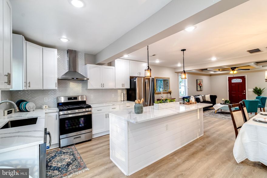 Stunning Renovation of this 4 Bedroom 3 Full Bath Cape Cod with a spacious Open floor plan- New Gourmet Kitchen with Large Island  and gorgeous quartz counters. Offering  a New  Stove, Dishwasher and Refrigerator- Living room with Coffered Ceiling . Luxury vinyl flooring throughout this lovely home.  2 Bedrooms on the Main Floor with New Ceramic tile full bath. Upper Level Primary Suite with  a new Full Bath, a Huge Shower Area with Ceramic Tile  and built in seating. Lower Level offers the 4th bedroom with a Egress window + Full 3rd Bathroom  with Ceramic tile.  Spacious Family Room  and Extra Storage Area. New 200 Electric-  New Hvac  System -New Roof- New Windows- New Rear deck off of the Kitchen. All of this plus the spacious backyard.  Offering off street parking.  Home is Situated in a water oriented community. House is not in the Baltimore County Flood plan due to the renovations completed on the exterior of the home.  This is truly a one of a kind  luxury home. Shed sold As Is.