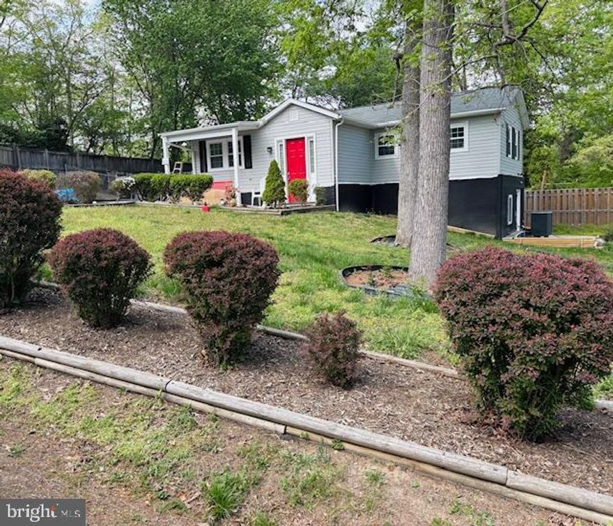 LOCATION & LAND .5+ ACRE!  INVESTOR FRIENDLY WITH LOWER-LEVEL OPTION TO RENT OUT. PUBLIC WATER & SEWER! A QUICK COMMUTE TO FT. BELVOIR! NEW HVAC, WATER HEATER, WINDOWS, DOORS, & ROOF! This charming home features main level living with a fenced-in .059 acre backyard.  The front foyer leads you to an open living area and bright kitchen with plenty of cabinet space, along with a lovely dining room.  A primary bedroom and bathroom are conveniently located down the hall, along with another small bedroom & bathroom. A versatile basement apartment is an added bonus with its own separate entrance and driveway! On the lower level you will find two bedrooms, a full bathroom, kitchenette, and bonus spaces, The lower level of the home offers the possibility of an in-law suite or rental income. (It was last rented for $1700/month.) Enjoy the peace and privacy of your large fenced yard with a walk-out patio, two garden spaces, and mature trees lining the property. The tool shed and backyard shed give you extra storage space. Enjoy relaxing on the front porch on a quiet street, along with ample parking.  Additional updates to the home include a new roof and gutters with leaf guards, siding, double hung windows, exterior and interior six-panel doors, hot water heater, HVAC, electrical panel, and tile floors in all bathrooms. Conveniently located just minutes to Food Lion, Aldi, Wegmans, Hilltop Village Center, Springfield Town Center, Workhouse Arts Center, Historic Occoquan, Davidson Airfield, and Fort Belvoir. Outdoor enthusiasts will enjoy the hiking trails, campgrounds, beaches, waterpark, golf course and more at nearby Mason Neck State Park and Pohick Bay Regional Park, both only 5 miles away. Quick access to Route 1, I-95, Gordon Boulevard, Telegraph Road, Route 123, Lorton VRE, and Franconia-Springfield Metro Station for commuting and getting around Northern Virginia easily. Don’t miss out on this great opportunity in Lorton with no HOA!
**The home fell out of contract due to financing contingency.