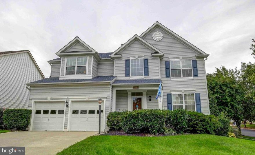 Conveniently located halfway between Baltimore and Washington DC is this Classic Crofton Colonial that has been updated throughout and features many amenities and upgrades.  As you pull up, you'll notice that this corner lot is professionally maintained and landscaped.  Lovely refinished hardwoods line the floor on the main level and the inside is recently painted.  This traditional layout features your front living room, which leads into the separate dining room, then into the kitchen which is open to the family room.  Gas fireplace makes for lovely ambiance and warmth.  Wide wooden shutters decorate the windows and matching shutters are included for the back slider.  The composite deck looks out onto the vinyl fencing that encircles the backyard.  Operated by remote control, the retractable Sunesta awning has built in lighting, as do the deck post caps.  The yard is equipped with an in- sprinkler system.  Upstairs you'll love the large bedrooms and amazing Master Suite with walk-in closet, separate soaking tub and shower along with dual sinks.  The basement is fully finished with a separate bedroom, full bathroom, and large living area.  Add a kitchenette and you have a separate in-law area!  Truly a beautiful home and totally turnkey.  Minutes to Annapolis and an easy commute to Fort Meade, this home is in the Crofton High School District!