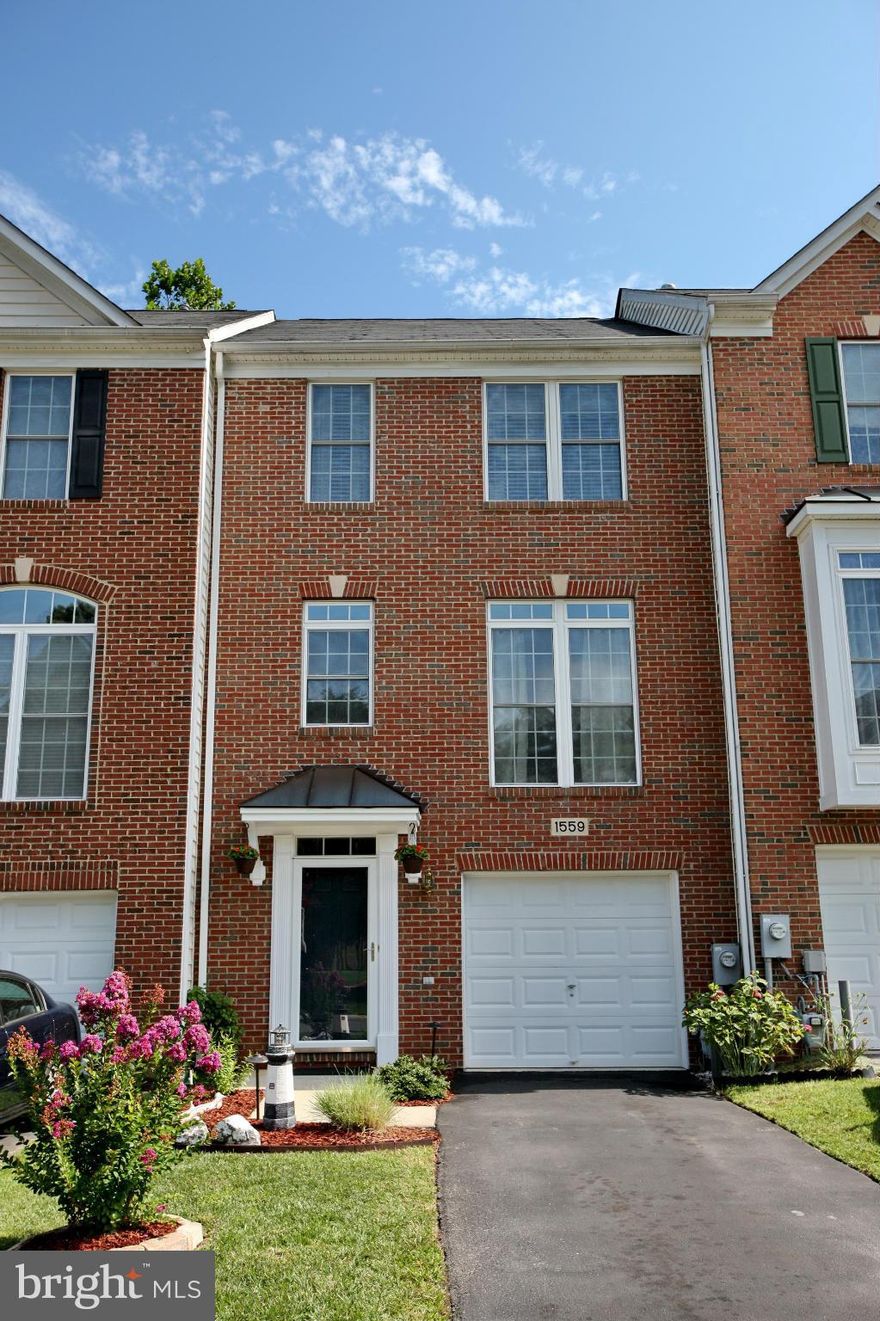 Beautiful brick front TH with garage. Bright open floor plan with hardwood flooring. Gourmet kitchen, double oven, double sink, gas cooktop, breakfast bar. Enjoy your coffee in the morning room and dinners on relaxing deck. Landscaped rear and front yard. Walk out to fenced in back yard with stone patio. Spacious Master bdrm with luxury bathroom suite. Living Rm has floor to ceiling windows