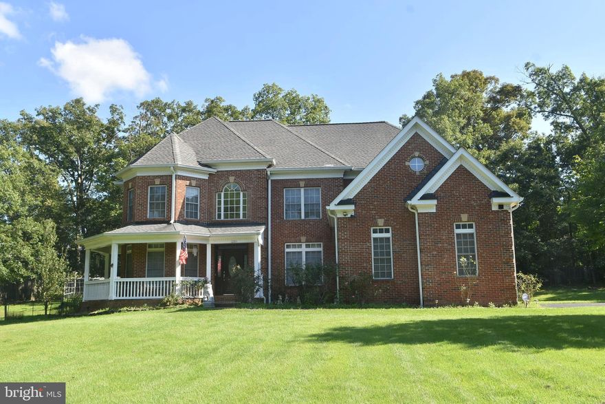 Great location!!! Custom Single Home with  3 car garage, 7 bedrooms and 5 full baths on the  1.1 acres lot.  This colonial style house has total finished 5,409 sqf. (Above finished is  3683. sqf, Below finished is 1726 sqf)
Step inside the main level  is soaring foyer ceiling with a gleaming chandelier and nice glossy hardwood floor throughout  the main level add warmth and character to the space, with elegant railings guides to upwards. 
On the left of main door is bright living area, and the lovely dinning area is on the right. The warmth and spacious family area has high ceiling with the cozy stone fireplace at the end.  There is a bright office room on the left that has door to the convenient full bath.  Nice Kitchen with wet bar featuring a sink, granite counter, and cabinets provides a convenient refreshment station. The bright eat-in area near to large windows and exercise room that lead to the huge wooden deck and the back yard.  Note: New roof in year 2021, New AC for upper level in year 2021.
Four nice and bright bedrooms with carpet floor and 3 full baths.  nice Zaccuzi in master bathroom.  There are a  walk -in closet , sitting room near to master bath on the upper level for added convenience. 
The finished basement expands the living and entertainment options, enjoy movie nights or game days in spacious area. with  3 bedrooms and full bath. this basement has walk -up on the right side to the garden.
The 3 car garage on the left side has door to the kitchen area. There is  anadditional water well for watering the lawn & garden.
This prestigious address  places you within a friendly neighborhood, perfect for raising a family or enjoying a peaceful lifestyle. The surrounding location of Fairfax offers easy access to top-rated schools, an abundance of shopping and dinning options, and commuter routes for exploring all benefits of vibrant community.