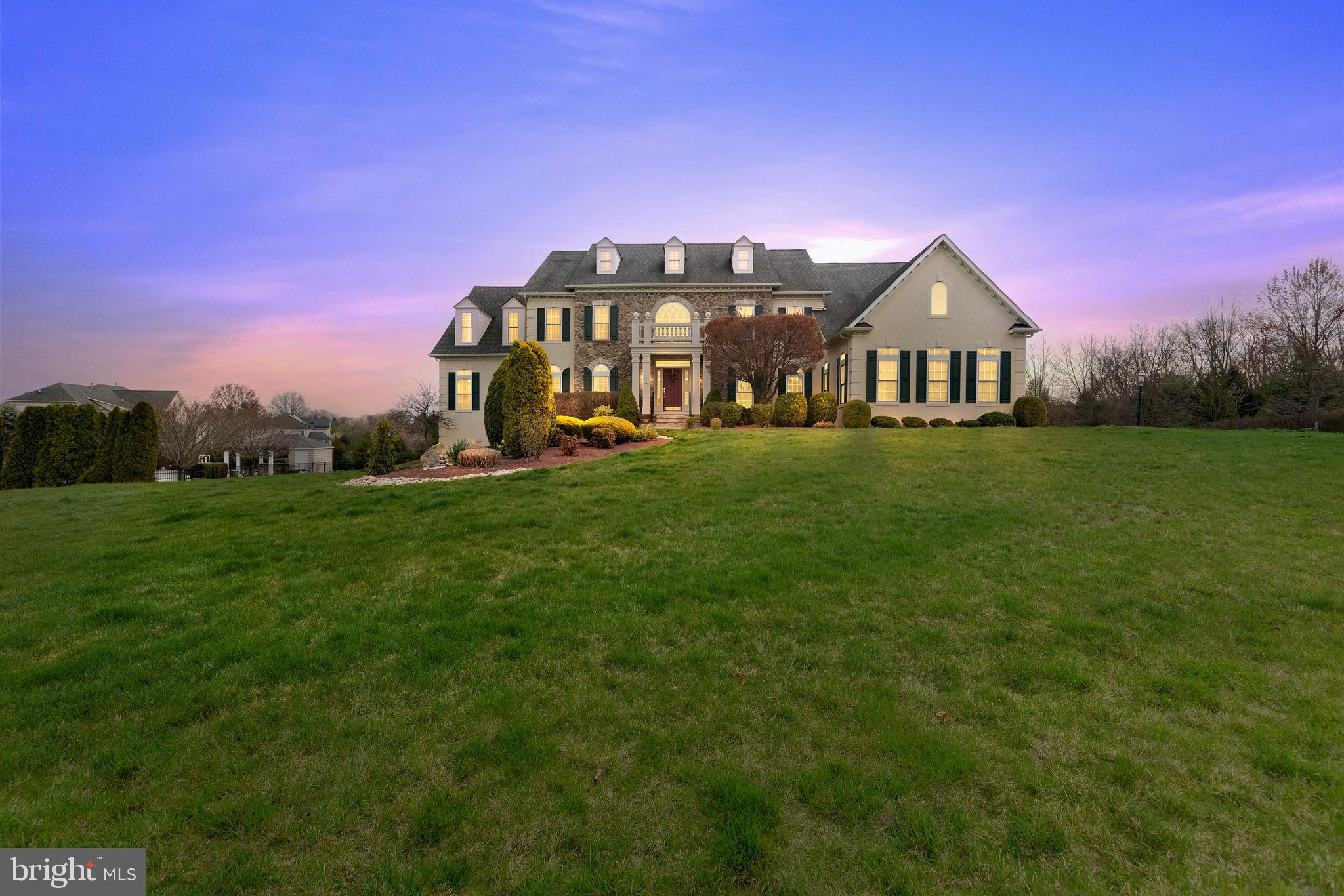 Welcome to this exquisite 5 bed 5.2 bathhome in Warner Meadows! Upon entering, you are greeted by a grand two-story foyer with dual staircases that invite you to relax in 7450 sqft of living space! To the right of the entry, you’ll find a formal dining room; to the left, you’ll find a formal Living Room. Straight ahead is the sun-drenched great room with cozy fireplace surrounded by a column of floor-to-ceiling stone. The gourmet eat-in Kitchen backs to a casual dining area. The kitchen features granite-slab countertops and backsplash, professional stainless-steel appliances with gas range and hood, center island with additional seating for casual dining, and a pass-through window to the sunroom. The main-floor laundry room has an abundance of cabinetry and folding space. Upstairs, you’ll find the luxury primary bedroom with tray ceiling, sitting area, and private spa-like bathroom with soak tub and dual headed walk-in shower, as well as an incredible walk-in closet. Get ready to entertain friends and family in the finished basement! Whether it’s watching the latest movie in your home theater, watching the big game at the full-sized built-in wet bar (seating x8!), or some friendly competition around one of your favorite game tables, there is more than enough space for all of it, and a 5th bedroom and bath for those extended-stay guests! Step outside, and enjoy outdoor living at it’s finest on one of the expansive decks, covered patios, or grassy area! There is an attached three-car garage and large driveway with parking for 10! Exceptional home! Excellent Schools, and excellent location! Easy access to Philadelphia, and the Jersey Shore! Call now to schedule your private showing!