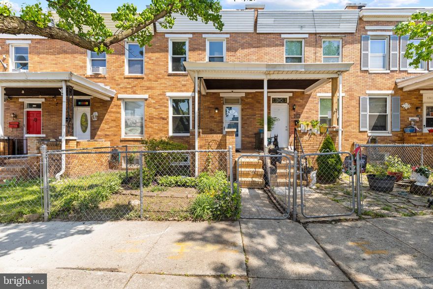 Welcome to 1915 Griffis Ave — a 2-bedroom, 1-bath brick rowhome in Morrell Park with major upgrades already done for you. This home is move-in ready on the main level, featuring brand-new luxury vinyl plank flooring throughout the living room, dining room, and kitchen. A brand-new furnace was just installed — buy with confidence knowing your biggest-ticket mechanical system is covered. All front-facing windows have also been recently replaced, improving energy efficiency and curb appeal.

The main level flows from a spacious living room through a charming arched doorway into the dining area, then into a galley kitchen with white cabinetry, laminate counters, a gas range, and rear door access to the backyard. Upstairs you'll find two bedrooms with original hardwood floors, ceiling fans, and generous closet space — including a character-rich built-in closet with upper cabinetry in the rear bedroom. The full bathroom features tile flooring, a tub/shower combo, and a white vanity.

Step outside to a fully paved, low-maintenance backyard with brick pavers and partial views of the downtown Baltimore skyline. The covered front porch and classic brick facade complete the picture.

Unfinished basement provides storage and houses the new HVAC system. Minutes to I-95, I-695, Carroll Park, and downtown Baltimore. Strong rental comps in the area at $1,600+/month make this an excellent investment opportunity as well. New furnace. New floors. New windows. Priced to sell.