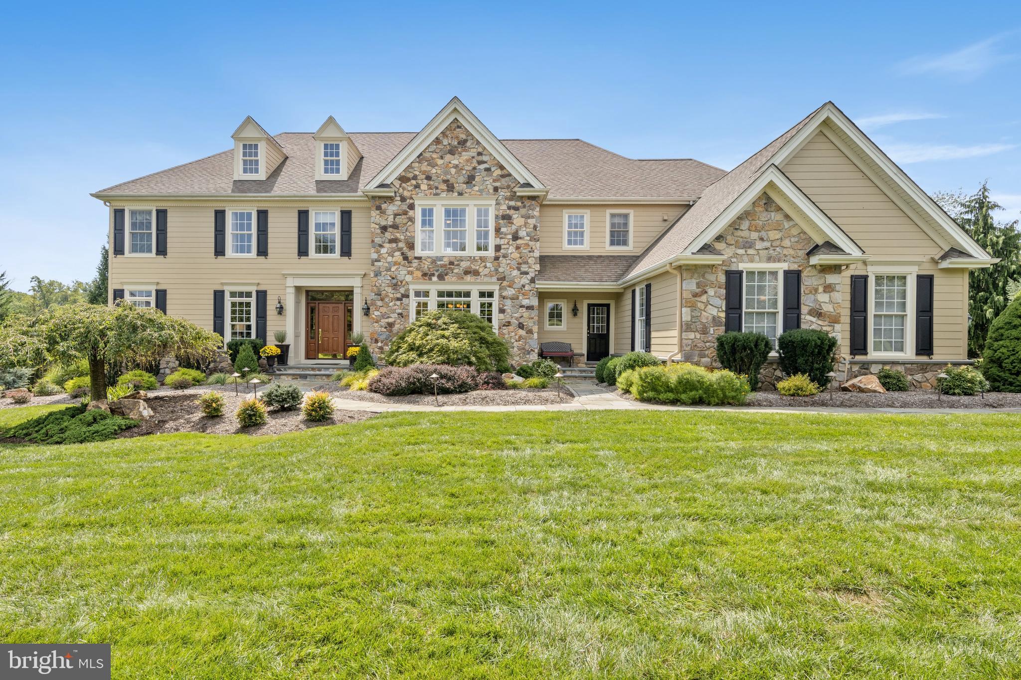 Just Listed in highly desirable Chantilly Farm, and located in the heart of bucolic Chester Springs is now available for Just One Lucky New Homeowner! Exceptional outdoor living space on expansive paver patio and one-acre flat lot with matured and professional landscaping serve as an outstanding backdrop for this estate-style home. Evening dining al fresco, relaxing and entertainment is highlighted by extensive accent lighting around property. Tremendous curb-side presence with a newer maintenance-free and worry-free exterior! No stucco concerns at this property as the homeowner painstakingly had the exterior entirely refinished. Accents include lovely newer carriage doors showcasing four-car attached garage, front door and Chester County field stone. Interior living spaces are equally remarkable with tasteful, timeless appointments and finishes. Hallmarks of this fine home include dramatic Center Hall Entry with curved staircase, extensive hardwood flooring, deep-set windows with transoms. Private office, Morning Room, Lovely Great Room with stone fireplace with raised hearth and three exposures of windows, two powder rooms, popular back staircase and mudroom. Heart-of-the-home Kitchen with exceptional center island! Large day lit finished lower level with entertainment bar complete with mini-fridge and sink and recreational spaces for any number of uses including gym, media room, billiards room and half bath. The second floor features five well proportioned bedrooms, four of which share two Jack-n-Jill baths. The homeowner's suite has a notably large walk-in closet and dramatic tray ceiling with an abundance of windows. The second floor also is home to convenient laundry room. Award-winning Downingtown East Schools and STEM Academy. Close to a host of popular shopping and dining destinations and local farm stands. Let's not forget easy access to PA Turnpike, Rte. 30 & 202 for easy commuting. Town & Country lifestyle at its finest.