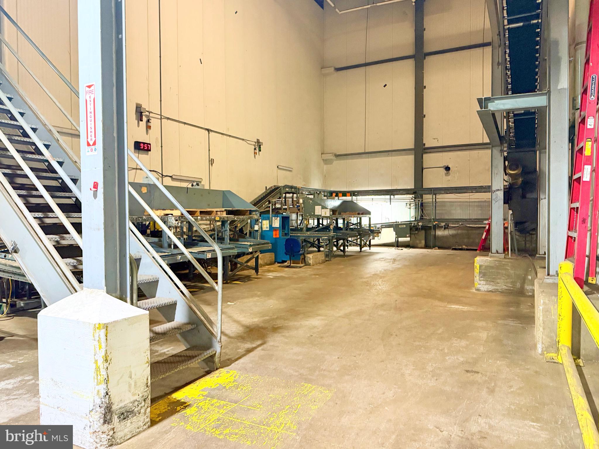 Positioned on a key corridor in Lancaster City, this expansive industrial property offers a rare opportunity for manufacturers, contractors, storage operators, and a wide range of other users, thanks to its flexible zoning (CM) and location just minutes from the city’s thriving downtown.
The space features lofty 38’ ceilings in most of the lease area, with racking already in place to accommodate substantial storage needs. Three loading docks with doors measuring 11'x8' make for efficient logistics, and the insulated building offers potential for temperature-sensitive uses such as food storage & manufacturing, which was its prior use as the Kunzler hot dog manufacturing facility. For those looking for additional space, the property features an additional 100,000 SF+ which the owners will entertain leasing as well, with great flexibility that can be offered on how much is leased to one party.
CAM fees will start at $1.50/SF. Sellers would prefer a lease to be a minimum of 5 years and are willing to sign on for much longer than that.
Included in the lease are 5 dedicated parking spaces, with abundant additional spaces available for $50/month each.
Basic office space and dedicated restrooms are in place, and with some light upgrades this property could easily become a clean, efficient, and highly functional workspace. The space is located next to what will become the headquarters for Topline Heating & Air, and provides an opportunity to get in at a lower price before the property is greatly improved. Take your opportunity to be positioned in the path of growth!