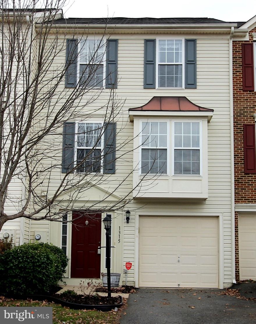 Why pay rent when you can own this affordable, low maintenance townhome in a great commuter & shopping location! Features include vaulted ceilings, large eat-in kitchen plus formal dining room, spacious living room with bump-out, master suite with soaking tub, separate shower, & walk-in closet, security system, large rear deck, & attached garage. Lower level rec/family room with fireplace walks out to the vinyl privacy fenced back yard. HOA includes front lawn mowing & trash service.