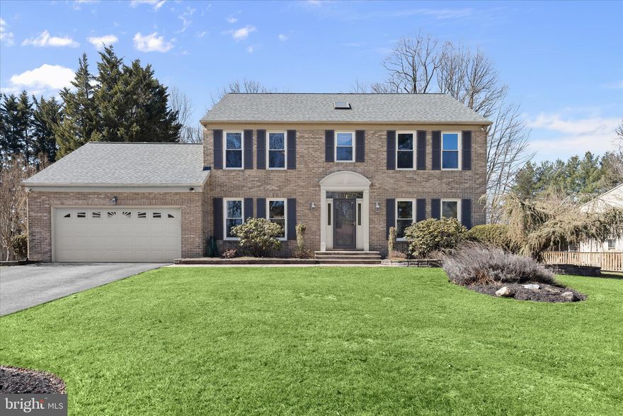 A rare offering in the sought-after Hunters Glen neighborhood, this exceptional residence has been thoughtfully expanded with a rear sunroom addition and a three-foot bump-out, creating a home that truly feels custom built. Featuring four bedrooms and three and a half bathrooms across three beautifully finished levels, this one-of-a-kind residence offers a unique opportunity to own a luxurious home with generous living space. Nestled on nearly half an acre backing to woods, the setting provides a peaceful and picturesque backdrop. Step inside to discover beautiful rich hardwood floors and stylish trim moldings that add a flair of sophistication throughout the main level. The formal dining room provides an elegant space for hosting dinners, while the front living room offers a comfortable space to gather. Double glass French doors in the living room open to the impressive family room that boasts a soaring vaulted ceiling with skylights and a cozy gas fireplace with brick surround. Bathed in natural light, the family room serves as the heart of the home. Prepare your favorite meals or entertain guests in the gourmet kitchen that is equipped with granite countertops, a decorative backsplash, elegant 42-inch cabinets with undermount lighting, a center island with an additional beverage sink, and a breakfast bar. The high-end stainless steel appliances include a Wolf six-burner gas cooktop with a range hood, wall oven, built-in microwave, and convenient warming drawer. Just beyond, the exquisite sunroom addition expands the living space, adorned with another breakfast bar for casual dining, more skylights and peaceful views of the backyard. Sure to become one of your favorite spots in the home, the sunroom has space for additional dining or lounging, with access outside to the patio and backyard. Finishing the main level is a walk-in pantry, half bathroom, laundry room, and access to the two-car garage. Ascend upstairs where the primary bedroom suite is a true retreat, graced with a vaulted ceiling and two large walk-in closets with organizing systems. The lavish en-suite bathroom highlights a freestanding soaking tub, dual-sink vanity with lighted LED mirrors, a skylight, linen closet, and a luxurious walk-in shower with double showerheads and a bench. Down the hall are three additional bedrooms and a shared hall bathroom with a tub shower. Downstairs, the fully-finished lower level includes an expansive recreation room, third full bathroom with a walk-in shower and several storage closets. A versatile bonus room on this level is perfect for an office, gym, or even a potential bedroom, with a cedar closet and a large storage room. Outside, enjoy relaxation in the fenced backyard that backs to trees, with a paver stone patio that has a retractable awning. A shed adds convenience for storing outdoor essentials. Additional highlights include zoned heating and cooling systems, a new roof, new triple pane windows, and a new Trex side porch from the laundry room outside.