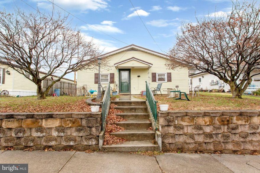 Unique home with lots of potential!  Big living room with brick walled fireplace.  Nice sized kitchen.  3 bedrooms and 1.5 baths.   Level fenced in back yard with  covered porch and 2 car detached garage with metal roof and additional off street parking.  Opportunities like this don't come around very often, and you don't want to miss it!