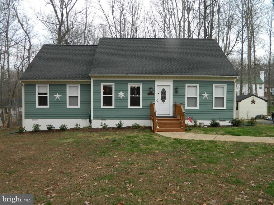 FULLY RENOVATED in 2014 to include new carpet throughout, new stainless steel appliances, new heat pump, new dual pane windows, new architectural shingle roof, and fresh paint. This cape cod style home is larger than it looks!! Large vaulted ceilings and skylights make for a large open floor plan. Spacious back yard complete with a 10x20 deck, fence, and large mature trees to create privacy.