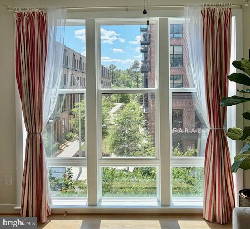 A rare opportunity to own one of the most desired units in The Lofts at Reston Station-this 2-bedroom + den residence offers peaceful treetop views, abundant natural light, and unmatched walkability, all steps from the Metro, dining, and daily conveniences. This charming home offers the rare balance of energy and convenience outside your door, with quiet, light-filled comfort inside-a combination that's increasingly hard to find. Private patio ideal for morning coffee or container gardening. Southeastern exposure with exceptional natural light all day. New carpet in both bedrooms. Quartz countertops and an expansive kitchen island. 9-foot ceilings and an open, airy layout.  Walk across the street to the Metro, ideal for effortless commuting. Immediate access to the Dulles Toll Road (just one light away), steps to dining at the JW Marriott, Davios, Founding Farmers, and more! Just across the street, the W & OD Trail offers miles of walking and biking. Friday night concerts and events nearby. Minutes to Reston Town Center. 10-minute drive to Tysons and McLean. This home is smart-home enabled, including a smart thermostat and the ability to integrate appliances and the front door into your phone. This energy-efficient home also includes a tankless Rinnai water heater. Never run out of hot water! This is a secure building and includes one dedicated garage space in the underground garage. Unassigned parking spaces are available in the rear of the building. As part of Reston Association, enjoy 26 pools, fitness centers, classes, events, community programs, and more. Priced to sell!  Flexible closing date. 

Open House Wednesday, May 6th, 3-5 PM, and Saturday, May 9th, 1-3 PM.