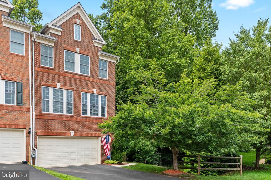 Luxury End Unit Townhouse w/ Serene and Private Park-Like Lot, Brand New HVAC (2025) with electric zoning, Kitchen w/ Granite Counter Tops, New Kitchen Aid Appliances, Marble Backsplash (2024), 
Quartz Vanities in Master and Hall Bathrooms—both with double sinks and newly-renovated hall bath shower, State of the Art Honeywell Security System and Cameras (2024), Updated Lighting Fixtures and Ceiling Fans through-out, Fireplace on main level, Built-in Shelving in bedrooms and LL closet, 2 decks and lower level patio, 2 Car Garage w/ storage cabinets, Hardwood floor on main level