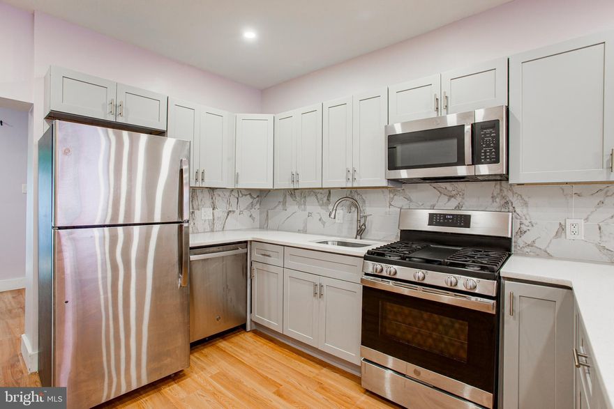 Welcome to 1317 N Myrtlewood Street! This recently renovated 3 bedroom / 3 full bathroom Brewerytown row home is available for November move in. 

The spacious main level provides the benefits of an open concept floor plan and is full of natural light. Flow through the living room, to the dining area and into the beautifully designed kitchen with ease. The kitchen is equipped with all stainless steel appliances, shaker cabinets and a beautiful quartz countertop that wraps into a waterfall peninsula perfect for quick dining. Situated just  beyond the kitchen is 1 of 3 full bathrooms, a laundry closet with stacked washer & dryer and sliding doors that provide access to a nicely sized fenced-in back patio ideal for outdoor entertaining. Ascend the stairs where you’ll be greeted by the 2nd Full Bathroom. Just down the hall you’ll find the generously sized middle bedroom with a double-doored closet for ample storage space. The primary bedroom is situated just down the hallway towards the front of the house and features an en-suite full bathroom! Head back downstairs to the lower level to find the 3rd generously sized bedroom with ample closet space. All bathrooms feature tile flooring and white subway bath tiles. Location! Location! Location! Coffee shops, grocery stores, restaurants, bars and much more all within walking distance. This property is conveniently positioned within access to downtown Philly, I-76 and various public transportation routes.