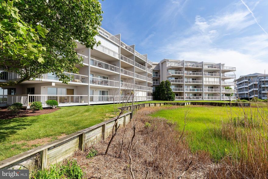 Tritons Trumpet is a quick walk to the beach as it is located on the shortest stretchs between the ocean and the bay in Ocean City, this beautifully furnished condo is in the perfect location for your vacation home. With three large bedrooms, two full bathrooms, and an open floor plan, you will have plenty of room for family and friends to visit. The living room features a comfortable sleeper sofa with an upgraded mattress, new 75-inch TV, and a 60-inch electric fireplace – great for summer ambiance and winter heat. All bedrooms have TVs and extremely comfortable mattresses. There is beautiful laminate flooring throughout with tile in the kitchen and bathrooms. The HVAC unit was recently replaced, and the oversized water heater will ensure you have more than enough water for all your guests. Step outside from the family room and enjoy the outdoor patio that overlooks the pool with views of the bay. Parking is a breeze at Triton's Trumpet with your assigned parking space and plenty of unassigned parking for your guests. Want easy access to the beach? Walk just two blocks East and boom, you are on the beach. Want convenience? Choose from an excellent array of restaurants, shopping, and entertainment; again just walking distance. This condo is ideally located and is completely turnkey.