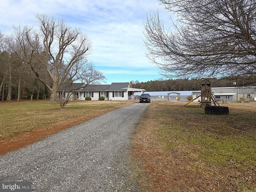 Beautiful country setting on 30 acres with a 3 bedroom, 3 bathroom ranch home, two large shops [30x400 & 50x100] and three income-producing poultry houses.