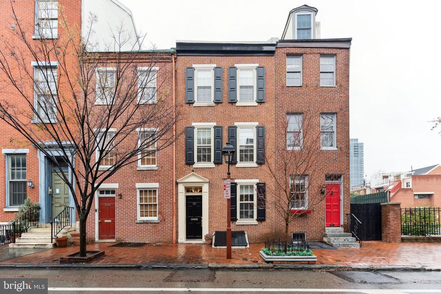 Step into your new home at the heart of Society Hill on Pine Street. This meticulously renovated Pre-colonial townhouse seamlessly blends old-world charm with modern convenience. Built in 1747, this historic home has been thoughtfully cared for, including a fully renovated kitchen and master bath, a new roof, and a roof deck adorned with stunning copper-capped deck walls and handmade metal trellises.  

The home boasts replaced, historically compliant, hand-made mahogany wood frames on all front windows, as well as replaced shutters and cellar doors, all crafted from mahogany. Replaced Pella windows are on the back.  

The first floor features a spacious front room, an eat-in kitchen, a powder room, and a den/dining room with access to the garden and patio. A beautiful center staircase leads to an office/den on the second floor, with two bedrooms and two full baths.  The owner’s suite sits on the third floor, with a spacious, light-filled bedroom and a fully renovated bath. The sunny roof deck is accessed from the third floor and provides ample space for outdoor dining and barbecuing.  The basement features brick archways and offers additional living space.  

New heat/AC, a built-in wall-to-wall closet unit in the master bedroom, and lovely natural light throughout the home add to its appeal. Conveniently located near transportation, shops, restaurants, and the renowned weekly farmer's market at Historic Head House Square, this home is a rare find in an ideal location. 

Schedule a viewing today and discover the graciousness of this remarkable home. Several nearby garages offer convenient parking options.