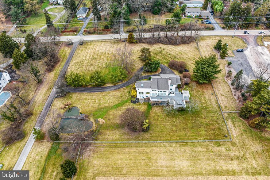 Welcome to this stunning custom contemporary home nestled on a picturesque 1.5-acre lot, embraced by the tranquility of a vast 275-acre farm and vineyard. This residence offers a harmonious blend of modern luxury and natural beauty, promising an idyllic retreat for those seeking serenity and sophistication.
As you approach the home, you're greeted by lush landscaping and the inviting charm of the surrounding countryside. Step inside to discover an open-concept layout that seamlessly merges with the breathtaking outdoor vistas. Expansive windows adorn every floor, framing panoramic views of rolling hills, verdant vineyards, and the serene private pond.
This home boasts three spacious bedrooms, each thoughtfully designed to capture the essence of comfort and elegance. With the potential to effortlessly convert one of the rooms into a fourth bedroom, flexibility meets style to accommodate your needs.
Descend to the lower level, where indulgence awaits. Unwind in the luxurious movie room, perfect for entertaining guests or enjoying quiet evenings with loved ones. Adjacent, discover a full bath and a rejuvenating sauna, offering a sanctuary for relaxation and self-care.
Outside, the allure of al fresco living beckons. Step onto the expansive deck, where a bubbling hot tub awaits, providing the perfect vantage point to soak in the beauty of the vineyard and pond below. Whether savoring a morning coffee or hosting intimate gatherings under the stars, this outdoor oasis invites you to embrace the essence of tranquil living.
With its seamless integration of modern amenities and natural splendor, this custom contemporary home offers a rare opportunity to experience luxury living amidst the serenity of a breathtaking landscape. Welcome to your private sanctuary, where every moment is infused with beauty, comfort, and tranquility.