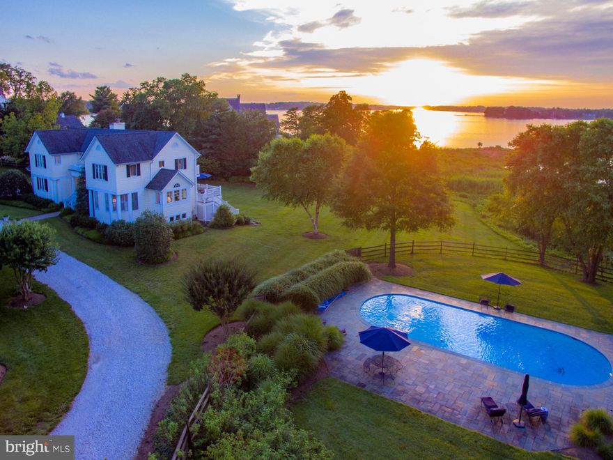 Happy Independence Day!  Pool, Pool, Pool and "Just Reduced $200,000.00."  Your Summer Oasis Awaits You.   Community Dock and Pier across the street now offering boat lifts in protected Harness Creek.      One-of-a-kind custom designed home privately situated offering breathtaking views of the South River as well as a Tidal Pond.  Timeless in design with exceptional custom decor this home was meticulously updated and expanded to include 2 master suites one with a sitting room and office both with balconies overlooking the water.  Gourmet kitchen, stone fireplace, cathedral ceilings, game room, multi-level decks and walls of windows make this home sunny and bright.  The private grounds include a resort style Gunite pool, hot tub, screened in porch for crabs, side loading two car garage and circular gravel driveway.  Magnificent outdoor and indoor living spaces make this home an ideal retreat and perfect for entertaining.  Enjoy all this home has to offer from the open floor plan , custom millwork, hardwood floors, built-ins, custom closets community piers and so much more.   Ultimate convenience to Route 50 ,97 and Historic Downtown Annapolis by car or boat.