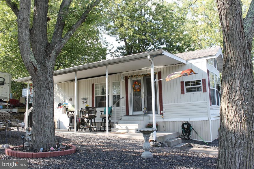 Wonderfully maintained SEASONAL RETREAT just minutes from historic downtown Gettysburg!  This 1 BR, 1 BA mobile is an ideal way to maximize your stay in Adams County.   Vaulted ceilings, open floor plan,  full kitchen, ceiling fans, laundry in unit, outdoor living spaces (covered patio, composite deck, campfire setting) and campground amenities let you enjoy summer fun day and night!  Pets allowed.  The Living Room has an accordion door to accommodate an additional sleeping area.   Starting November 1, 2024, the campground will no longer offer Annual Campsites.  Thus, this Annual Campsite will become a Seasonal Campsite once it transfers to the new owner.  Seasonal refers to the April thru October timeframe.  Starting November 2023, this campsite will be on a month to month lease for the current owner.  Buyer must be approved by Round Top Campground.  Extensive amenities make this a desirable locale; amenities include an inground swimming pool, separate kiddie pool, new mini golf, horseshoes, playground, outdoor movie theatre and so much more.  Showings are limited between 0330pm-0630PM all days.