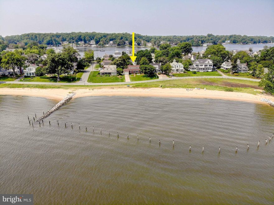 Chesapeake Bay Cottage with Unmatched Views in Prestigious Bay Ridge. Welcome to Bay Ridge—Annapolis’ most coveted waterfront community—where charm, history, and lifestyle come together. This storybook cottage offers one of the best Chesapeake Bay views and frontages in the neighborhood, with a sandy beach just steps from your front door. Featuring 4 bedrooms and 2 bathrooms, this home exudes coastal charm and comfort. The main level includes two bedrooms, a dining room, a welcoming family room with beamed ceilings and a cozy fireplace, and a separate living room with its own fireplace—perfect for gatherings with family and friends while enjoying the warmth and character of this timeless home. Upstairs, you’ll find a spacious primary bedroom, an additional bedroom, a full bathroom, and a conveniently located laundry area. The home also includes a cellar with a third fireplace, providing excellent storage and additional potential. An expansive yard completes the setting, ideal for entertaining, gardening, or simply relaxing while soaking in the breathtaking water views. Life in Bay Ridge is truly one-of-a-kind. The community boasts world-class amenities including a bayfront pool, deep-water marina, clubhouse, sandy beaches, playgrounds, basketball and pickleball courts, and an active social calendar with year-round neighborhood events. All of this is located just minutes from downtown Annapolis, Eastport, the Naval Academy, and the area’s best dining, shopping, and entertainment. Whether you’re looking for a weekend retreat or a full-time waterfront lifestyle, this cottage offers an incredible opportunity to own a piece of paradise in one of the Chesapeake Bay’s most prestigious enclaves.