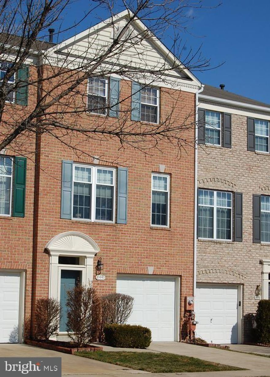 Welcome to 8441 Gold Sunset Way   this spacious 2 bedroom, 2 full bath, 2 half bath townhome features a large eat-in kitchen, brick fireplace, two en-suite large bedrooms, fenced yard, a garage with driveway, and the front yard is maintained by the community association. Close to major highways, shopping centers, restaurants, and institutions.