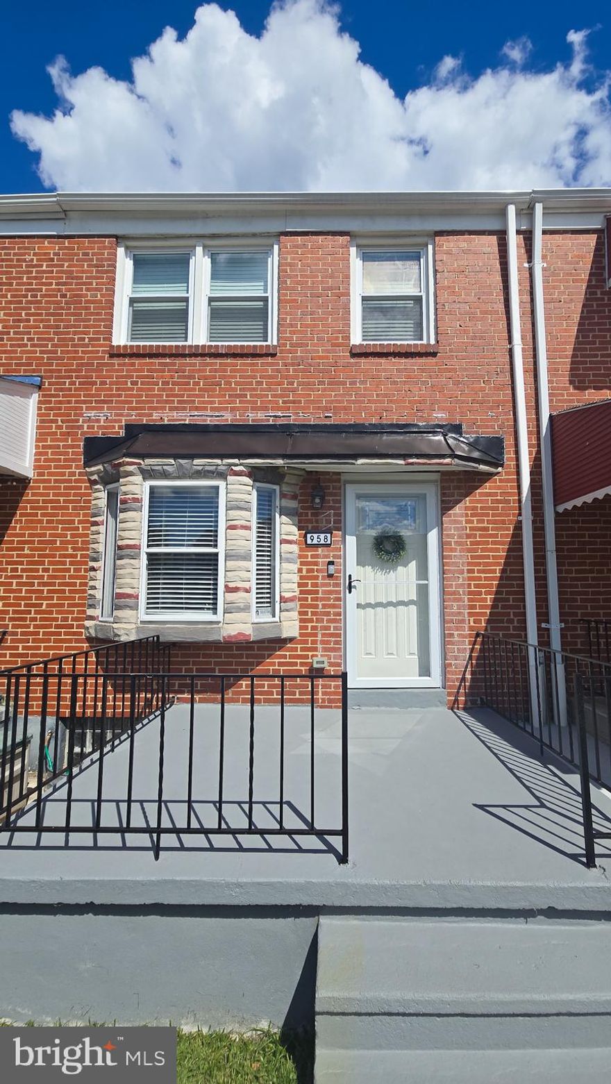 Beautifully maintained 3 bedroom townhouse with 2 full bathrooms, a fully finished basement and numerous updates throughout. Featuring a welcoming layout, gleaming wood floors and stylish finishes that are showcased with ample natural light in all rooms.  Updates include recessed lighting on the main level as well as in the basement, new carpet, refinished wood floors, beautiful tile in the second floor bathroom, pantry cabinets in the kitchen, newer appliances and fresh paint in every room. Energy efficient windows are complete with high quality blinds for your convenience.  A lush and verdant front yard has been meticulously maintained and is fully fenced. Enjoy the spacious and sunny front porch or cook out on the brand new deck just off of the kitchen. This lovely home is located minutes from shopping, waterfront dining and parks.