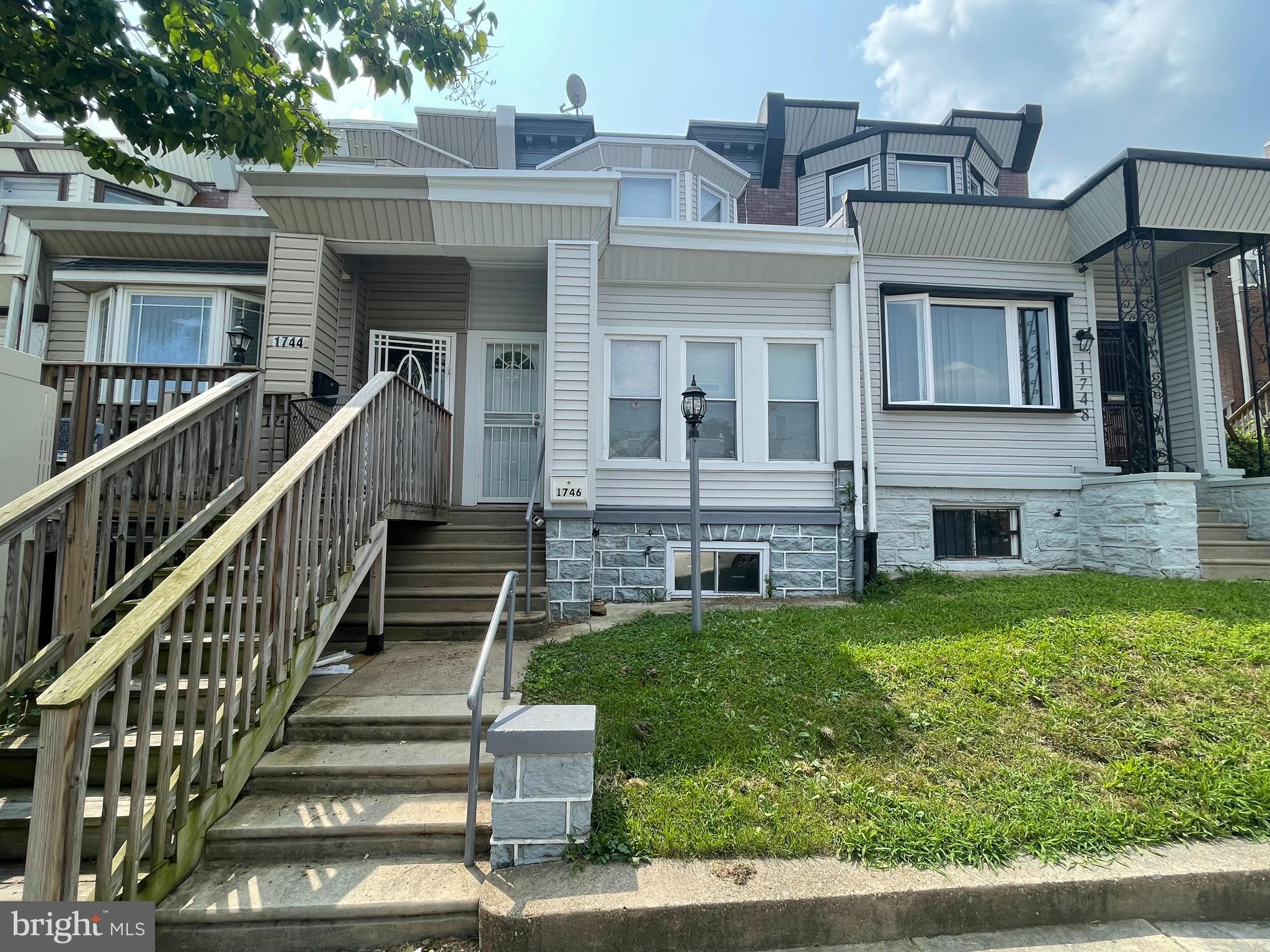 Welcome to this well-kept spacious row townhome situated in Overbrook. The exterior of this home offers aluminum siding, a lawn lantern and small front lawn. Step inside to the bright sunroom with recessed lighting. The entry to the living room is prefaced by a small vestibule. The living room is large with the fireplace as a focal point, and also has recessed lights and a ceiling fan. There is a formal dining room offering recessed lighting, and a storage closet. The kitchen has been recently upgraded, and offers character with its off-white cabinetry. The second level of this home has three spacious bedrooms. Each bedroom has larger than normal mirrored closets. There is a hall bathroom that has been newly upgraded. Head to the basement, and you will find a half bathroom, laundry area, and basement with new utilities. The hot water heater was installed in 2024, the heater was installed in 2022. The property is near public transportation, and shopping. Schedule your showing today.