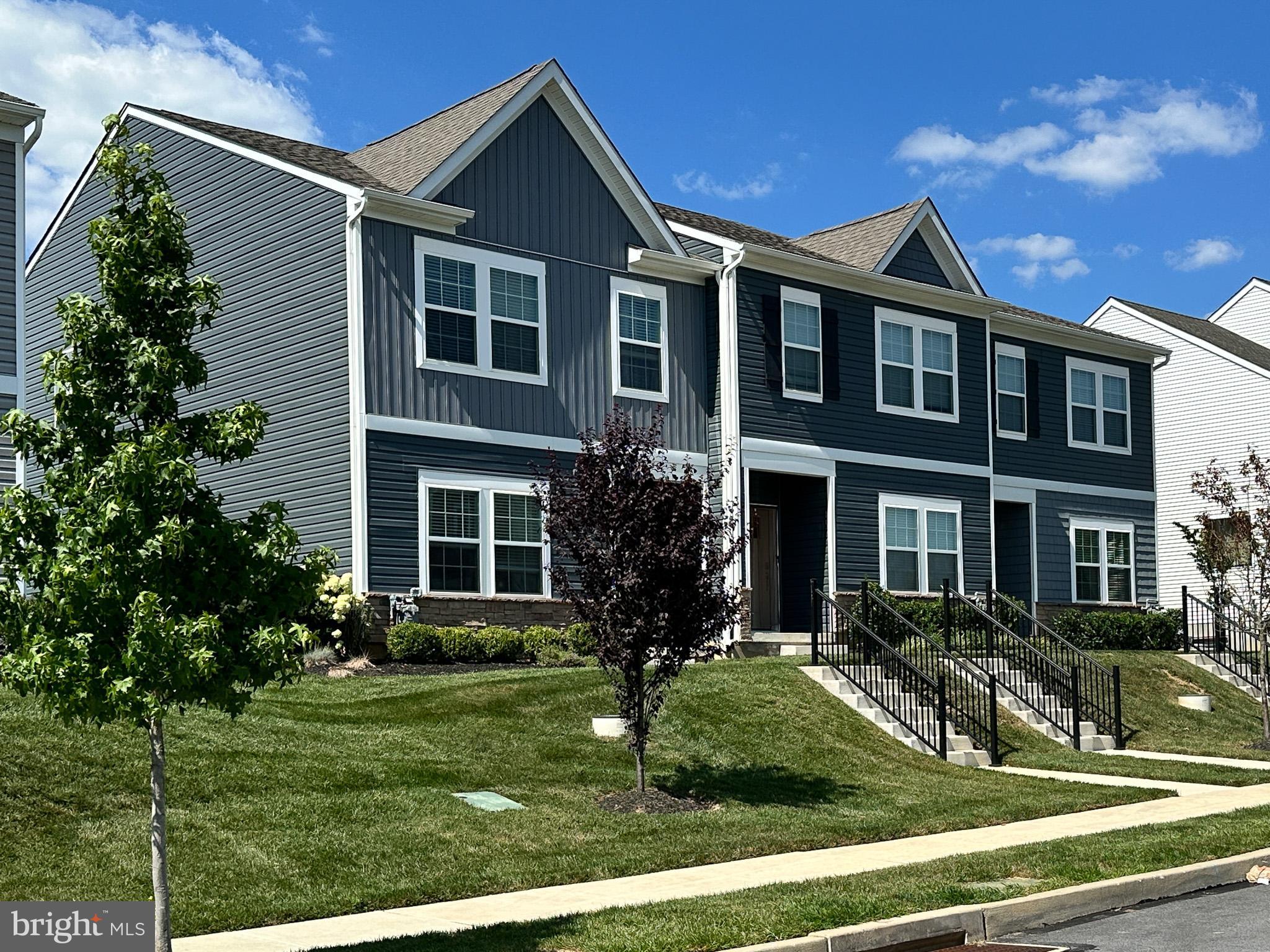 The former model home is available in the fabulous and new Sadsbury Park community. A 250-square-foot bonus room is part of the clever design of this sample home. The community boasts a highly convenient location, situated close to all the new shopping and dining that have recently been completed to the west. Sadsbury Park offers an array of amenities designed to foster outdoor activity, neighborly interaction, and an active lifestyle. Your next home awaits in a community that features a Swimming Pool, Playground, Dog Park, Jogging Trails, and a Bike path. There are athletic fields for all kind of sports, a Cabana and Outdoor grills. Wow, this is a well-planned and feature-packed community! The home at 320 Trego is an end unit model home that is just two years old.
The garage was converted by the builder to an excellent and huge bonus room filled with light, windows, and a glass door out to your double-wide driveway. Need a home office? Bingo! Upgraded and matching your sense of style at a bargain price. Nestled in the charming community of Sadsbury Park, this exquisite end-of-row townhouse offers a perfect blend of modern elegance and cozy comfort. Built in 2022, this home boasts 1,492 square plus the bonus square footage of meticulously designed living space, featuring three spacious bedrooms and two and a half luxurious bathrooms. Step inside to discover a warm and inviting atmosphere enhanced by crown moldings and luxury vinyl plank flooring that flows seamlessly throughout. The heart of the home is the gourmet kitchen, complete with a built-in range and a convenient butler's pantry, perfect for culinary enthusiasts and entertaining guests. The eat-in kitchen and breakfast area provide a delightful space for casual dining, while the family room off the kitchen fosters a sense of togetherness. Retreat to the upper floor laundry for ultimate convenience, making daily chores a breeze. The thoughtful layout ensures that every inch of this home is utilized for comfort and functionality. Outside, the association takes care of common area maintenance and lawn care, allowing you to enjoy the beautifully landscaped surroundings without the hassle. Embrace a lifestyle of leisure with access to community amenities that enhance your living experience. This property is not just a house; it's a place to create lasting memories. Experience the perfect blend of luxury and comfort in this stunning townhouse, where every detail has been crafted for your enjoyment. Your opportunity to see this absolute gem without an appointment is at the Sunday open house on August 24th from 1 to 3 PM.